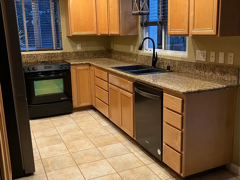 Kitchen with new stainless steel appliances