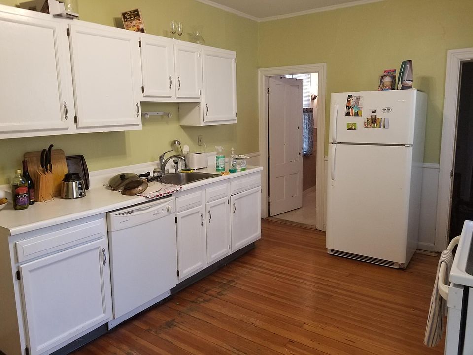 Kitchen with dishwasher. Bathroom off of kitchen