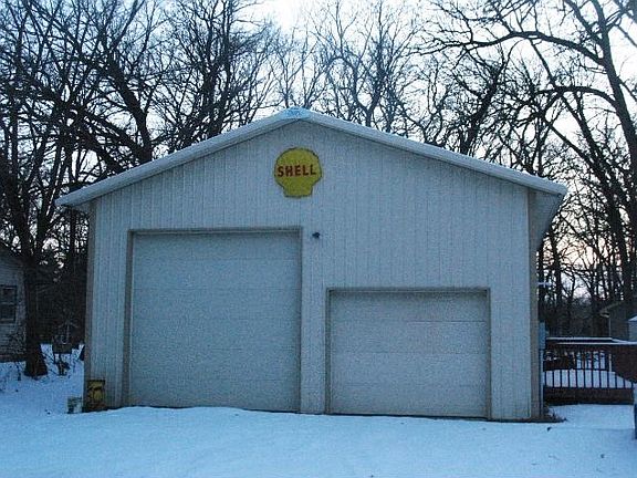 30x40 w/14' with Air compressor, 15,000 lbs hoist, office, heat.