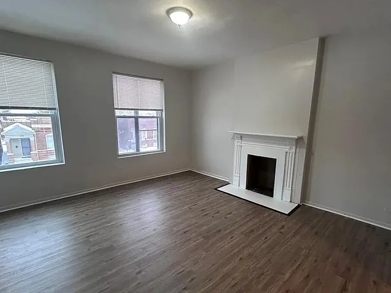 Bright living area with decorative fireplace and natural light