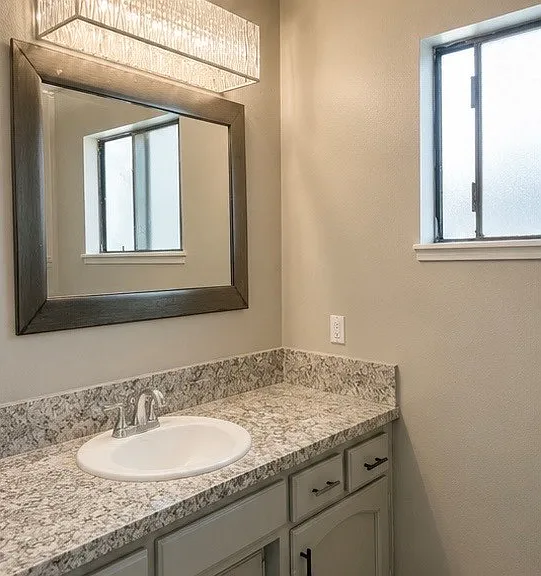 Recently remodeled full bathroom with modern finishes.