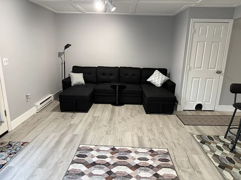 This brand new couch folds out to a bed and it also has storage