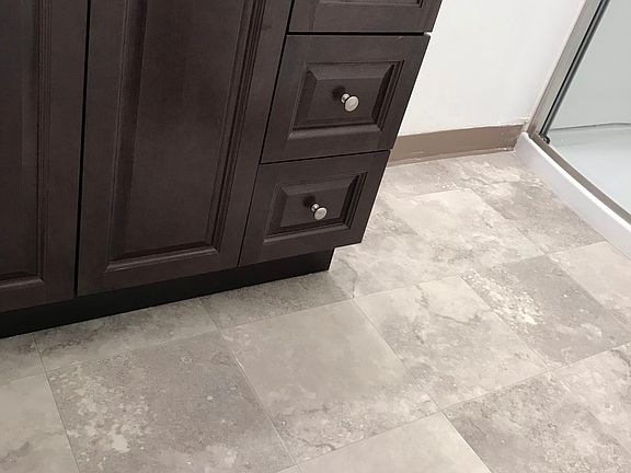 Master bath room floor with free space for laundry baskets