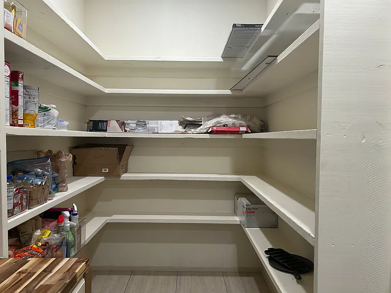 Oversized walk-in pantry with ample room for everyone