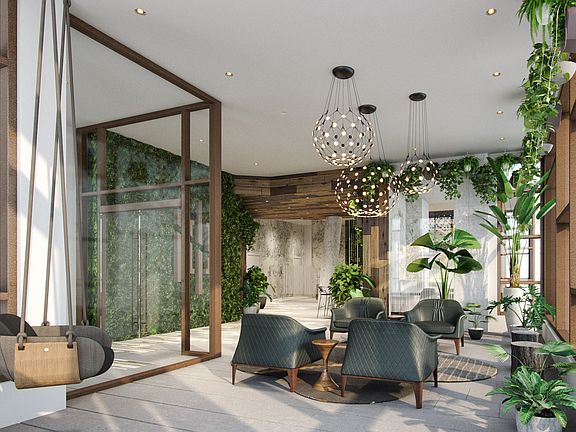 Welcoming lobby with a communal table for flexible work options or simply catching up with friends