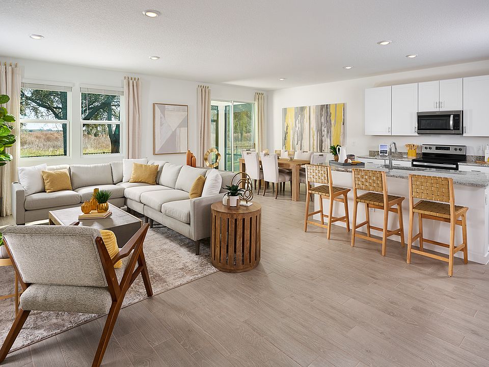 Great room of the Orchid Plan modeled at Lakes at Bella Lago.