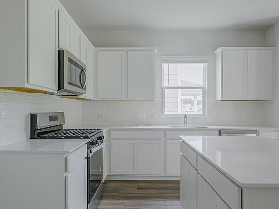 Package A Kitchen with beautiful white cabinets and granite countertops