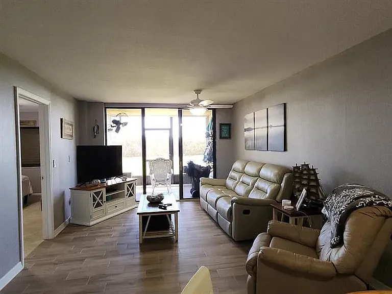 Livingroom with slider to beach and pool