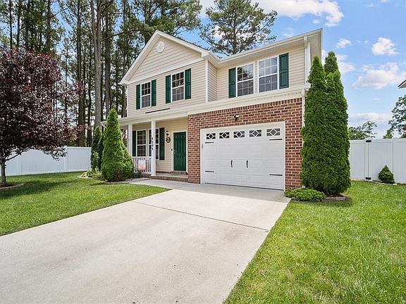 Private driveway and attached garage. 