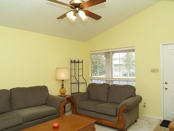 Living room with vaulted ceilings.