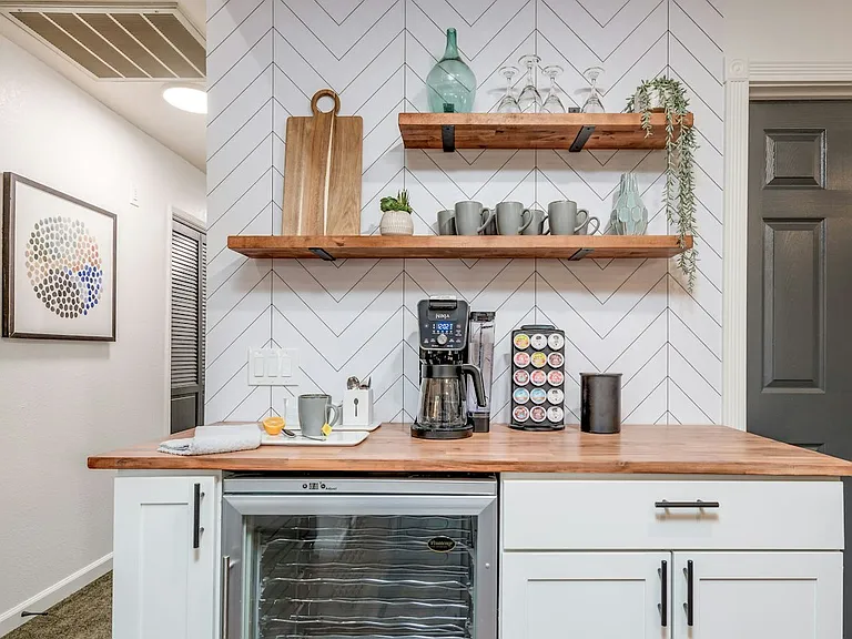 Wine refrigerator is included. Coffee maker not included.