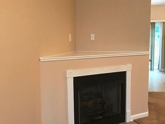 Huge living room off of kitchen with fireplace and 1/2 bath downstairs