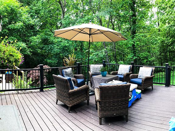 Sliding glass doors lead to walk-out deck (trex) that is perfect for entertaining!