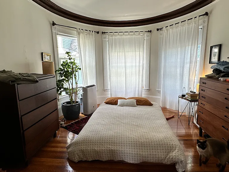 Master bedroom with curved glass windows