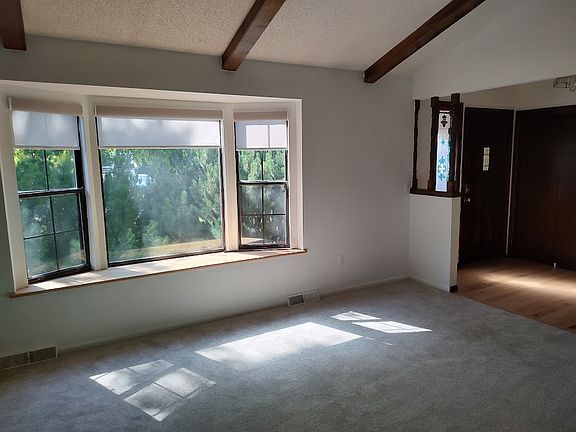 Front living room window and entry hallway