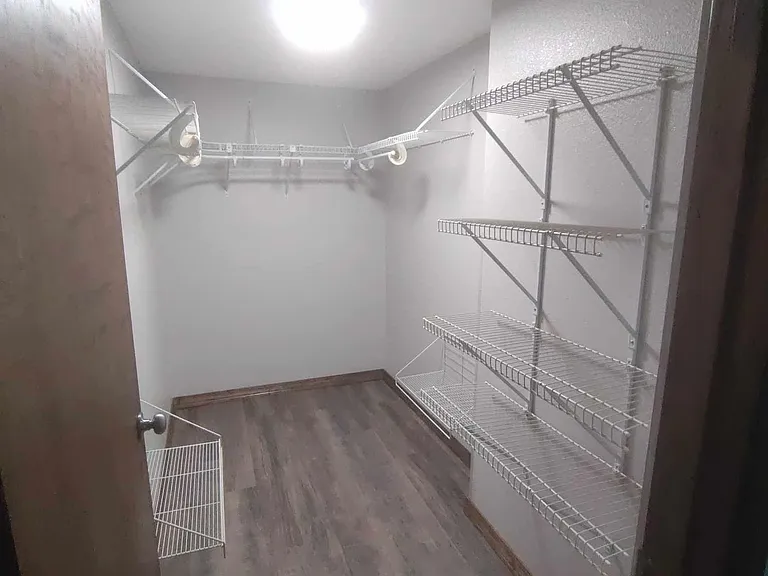 Large walk-in closet in master bedroom