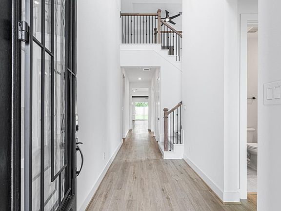 Great room with a fireplace and a view of casual dining