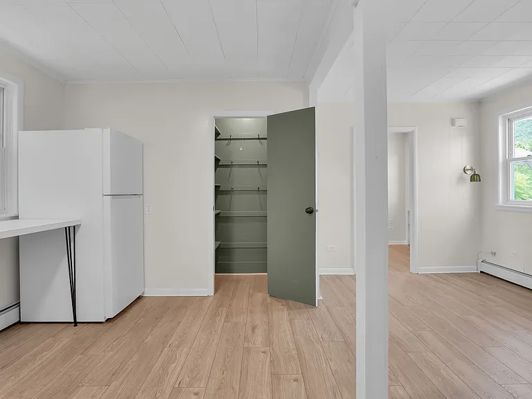 View of kitchen and dining room from front patio door - extra large pantry