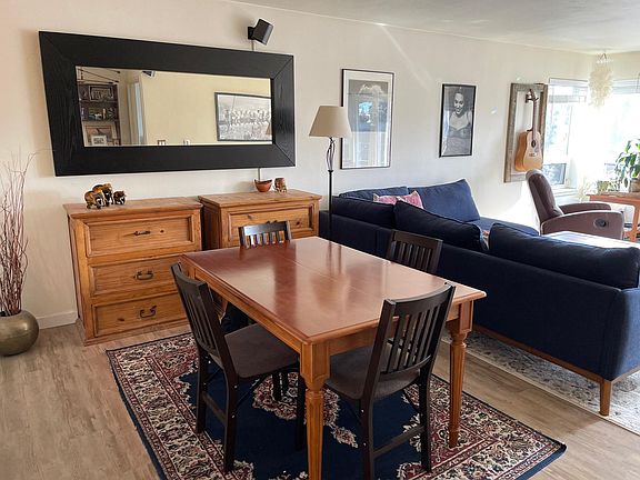Dining space comfortably fits between living and kitchen areas