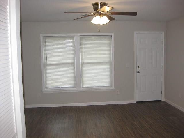 Living room facing towards door that leads to the deck.
