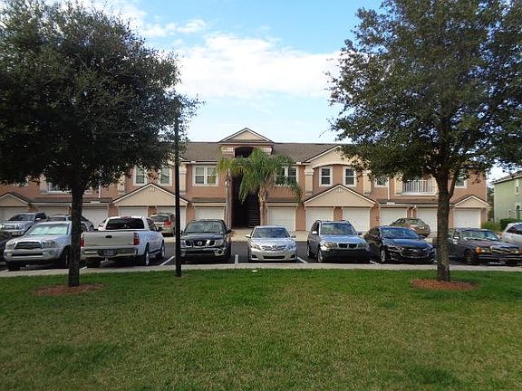 This pciture was taken from the landscaped area directly across the street from the townhome. It is a nice grassy space to play with children and/or pets.