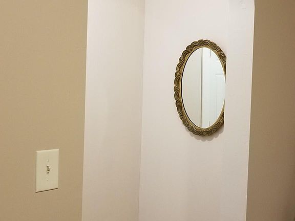 Unique front entrance area with mirror