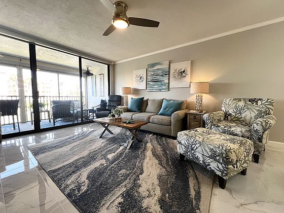 Living Room with Flat Screen TV and Water Views