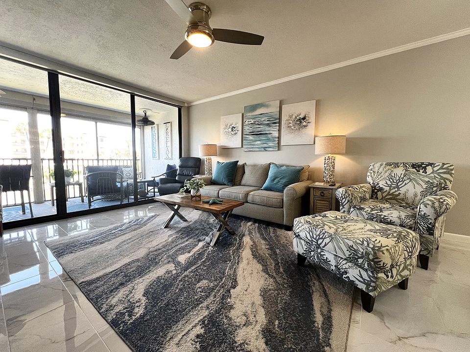 Living Room with Flat Screen TV and Water Views