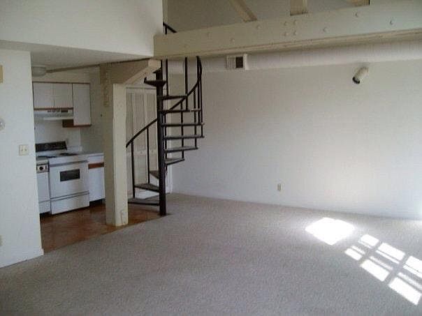 Open floor plan with spiral staircase