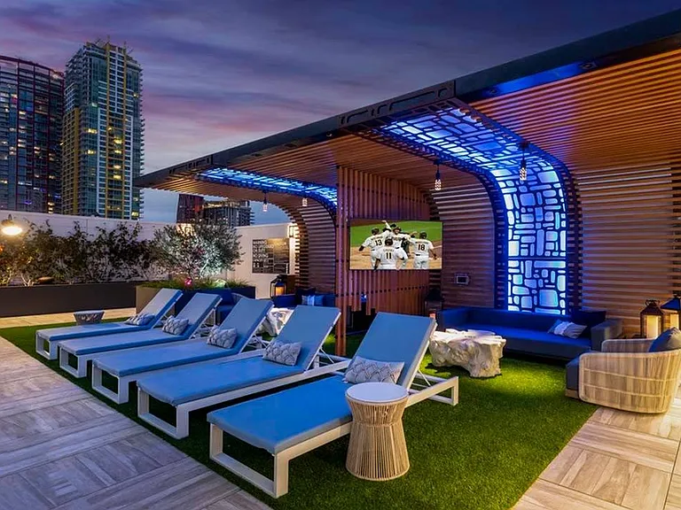 Hip lighting illuminates the rooftop at Modera San Diego in the evening, perfect for taking in stunning views of the city