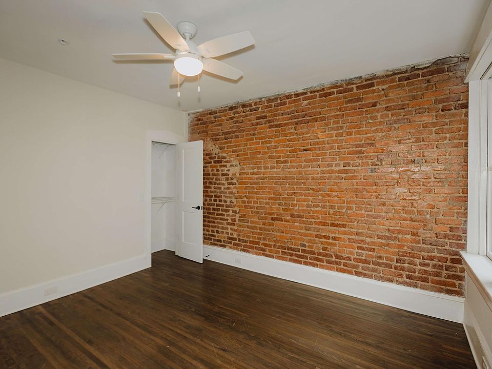 Exposed brick bedroom