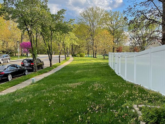 Side view of property. It is a large end lot, but only a portion of the property is fenced in. Fenced in portion is still very large.