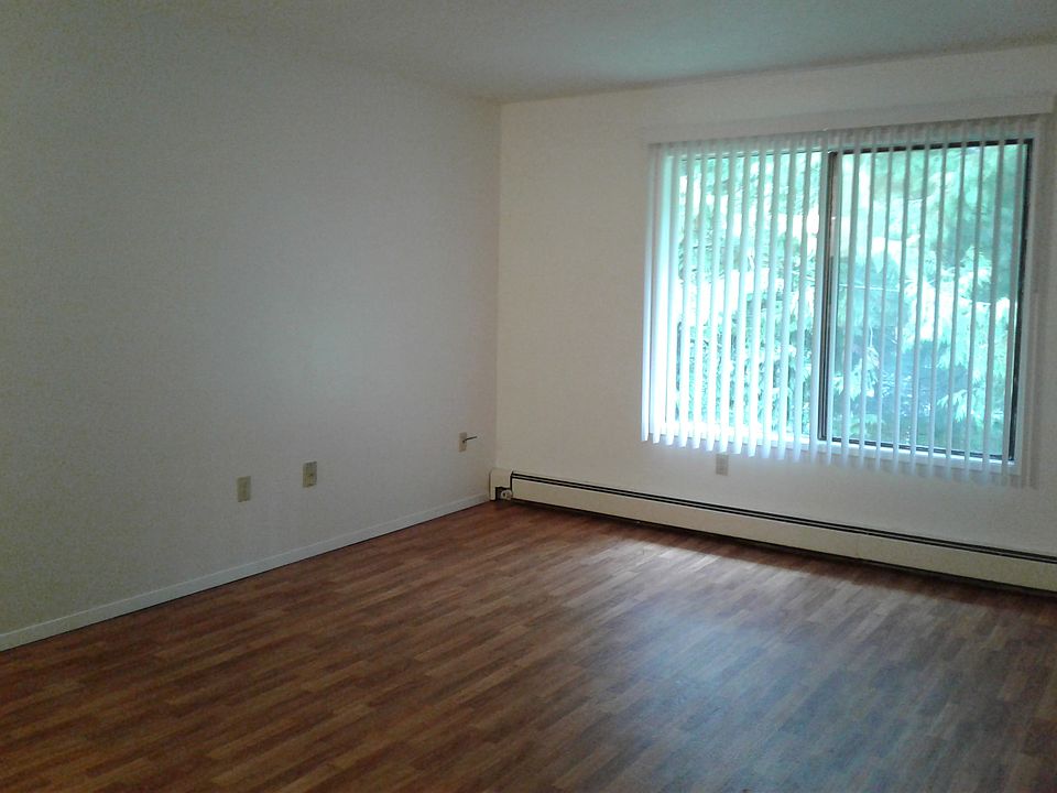 UPPER FLOOR UNIT, LIVING ROOM: WOODEN FLOOR, VERTICAL BLINDS