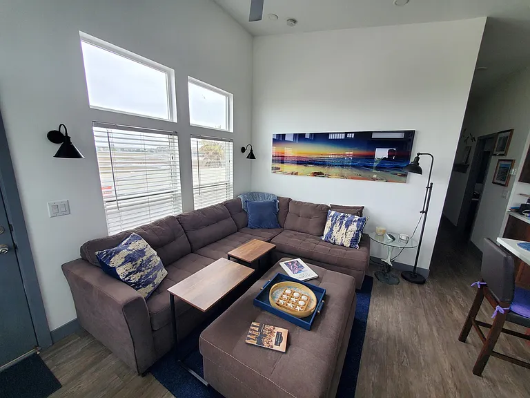 Comfy couch in living room with view of wetlands