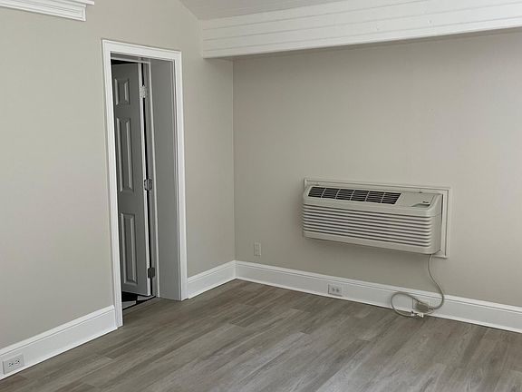 Studio room with ceiling fan and Heat AC Unit