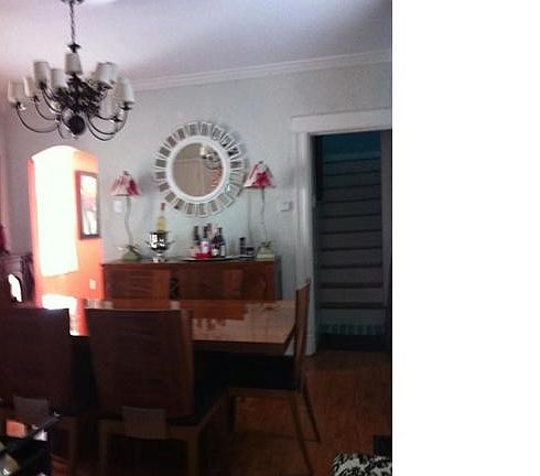 Separate Formal Dining room with Pergo wood floors - entry to kitchen other exit leading upstairs - chandelier negotiable.
