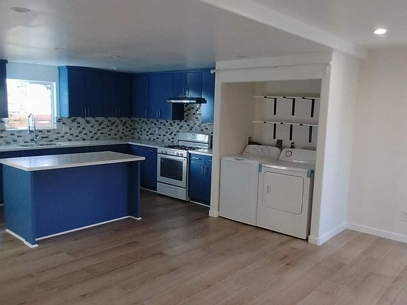 Large kitchen, in-unit laundry, view of entry