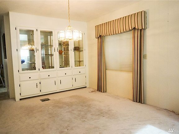 The Dining Area has a huge built-in Display Case Hutch.