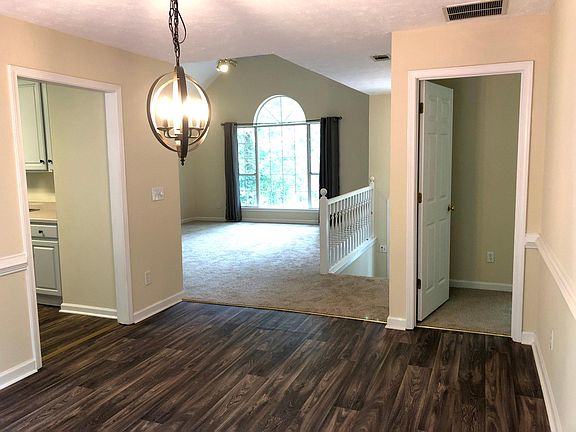 Dining room looking into living room. Door to master bedroom on right, kitchen on left.