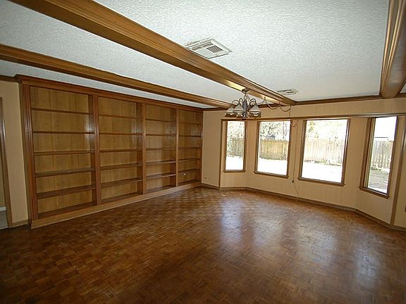 DEN HAS BUILT-INS AND OVER LOOKS THE BACK YARD