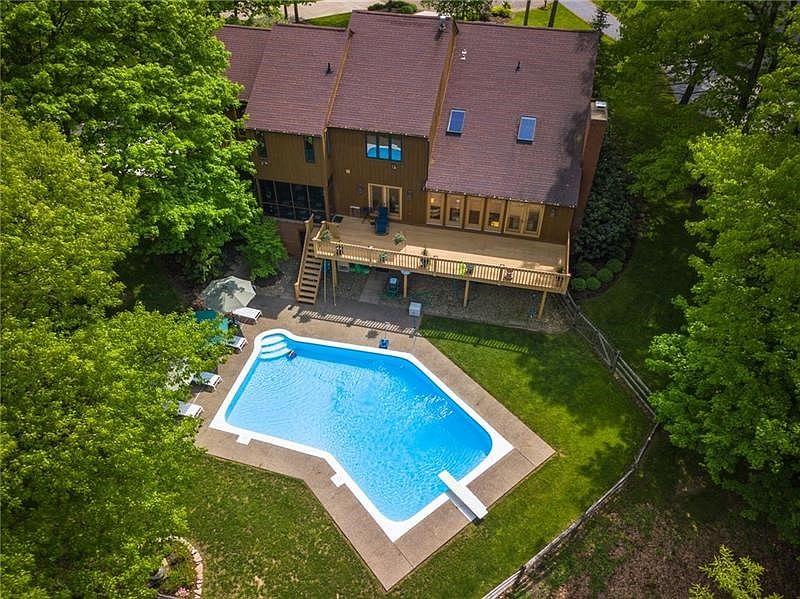 Privacy for family living and entertainment ... an extraordinary backyard, your home encourages the connection with nature and t