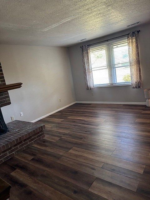 Living room. Windows that look out to the front yard.