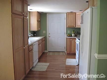 Kitchen : New cabinets and counter tops. Appliances stay.
