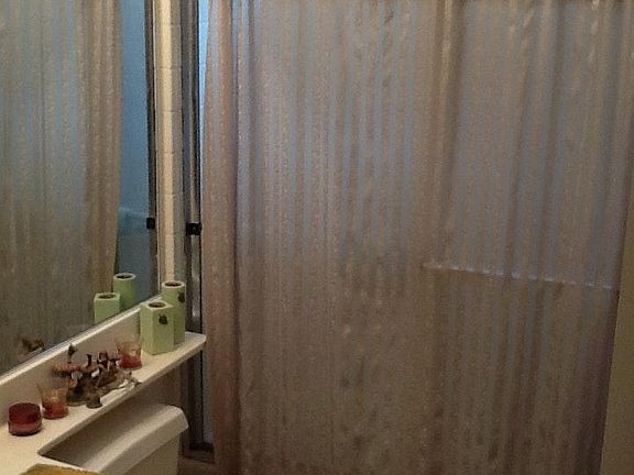 Master bathroom with shower curtain enhancement