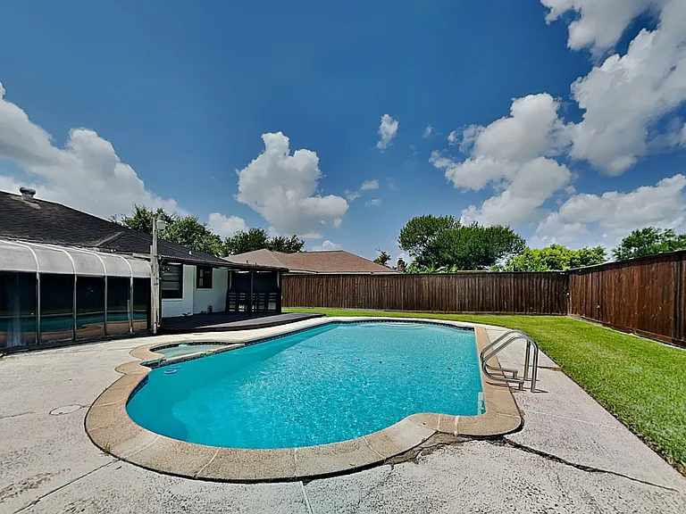 Spacious backyard with a kidne