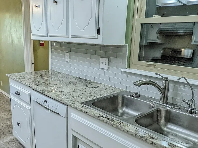Kitchen with reverse osmosis system for bottled-water quality water