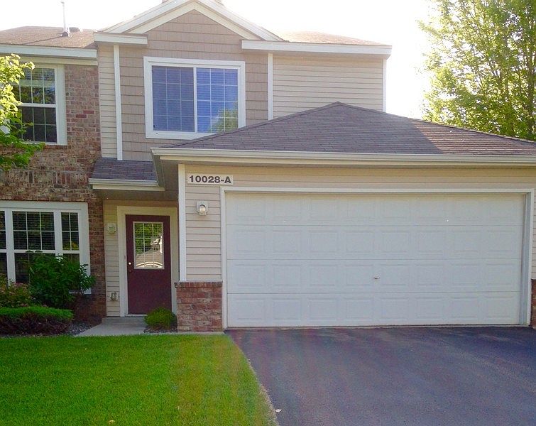 Welcome to 10028-A Pierce St. NE
						:
						Front view of home, 2 car garage