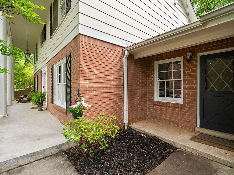Side view of secondary door and front porch