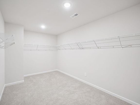 Walk-in closet in the Taylorsville floorplan at a Meritage Homes community in Garner, NC.