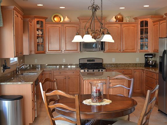 Kitchen
						:
						Large eat in kitchen with granite countertops and stainless steel appliances